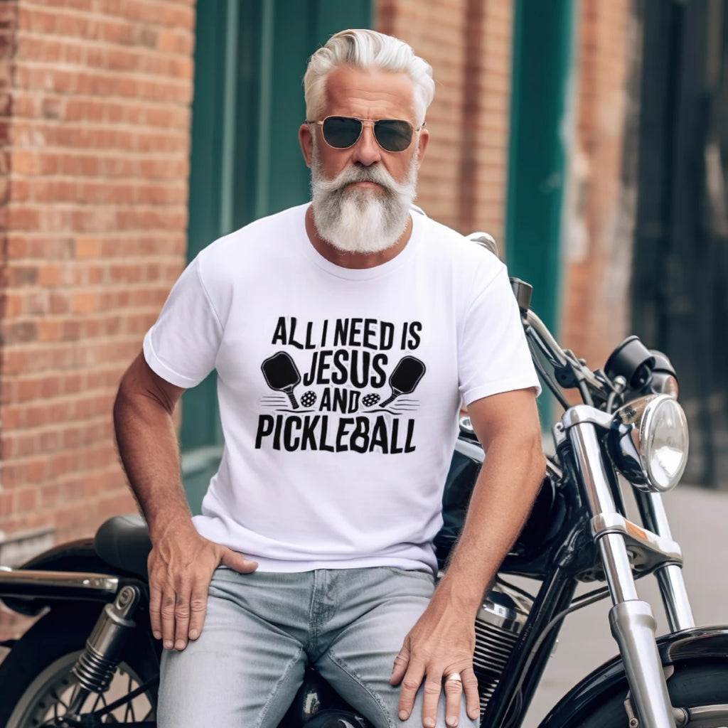 FunzyGear All I Need Is Jesus and Pickleball T-Shirt featuring faith-based and pickleball graphic design on a comfortable tee.