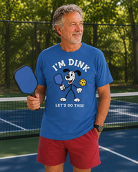 Load image into Gallery viewer, "Person wearing Dink Let's Do This pickleball graphic tee on the court, ready to play"