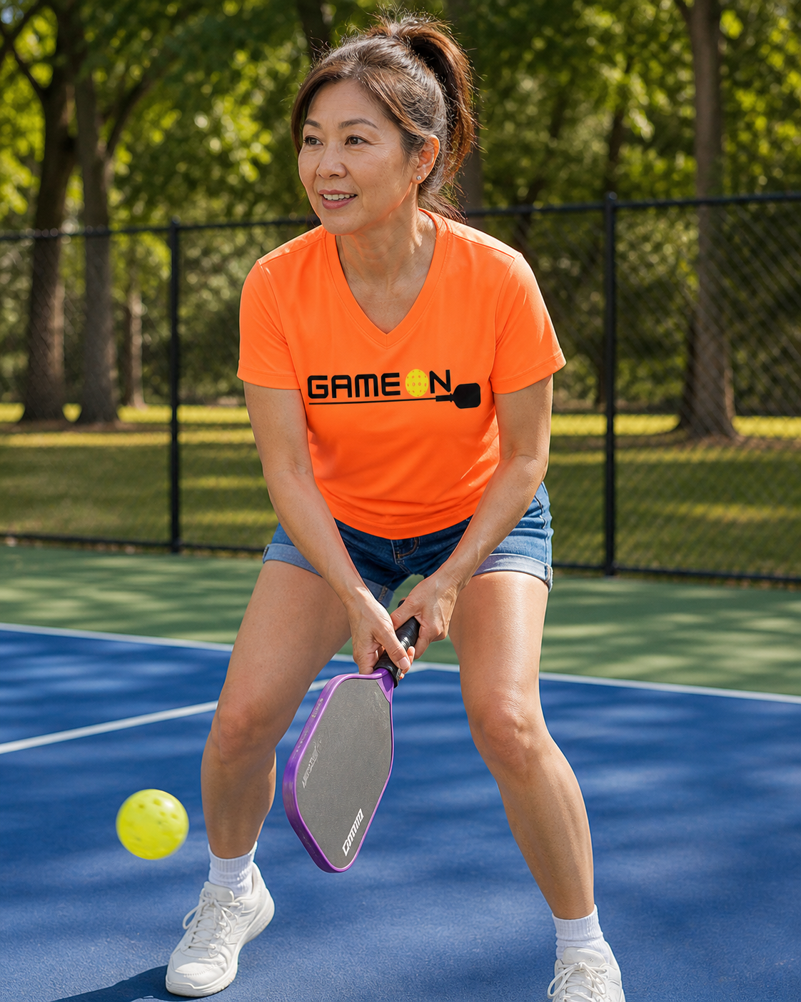 Woman wearing Ladies Game On Pickleball graphic tee
