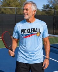 Load image into Gallery viewer, "Man wearing Mens Pickleball USA Streak moisture-wicking t-shirt with bold patriotic graphic"